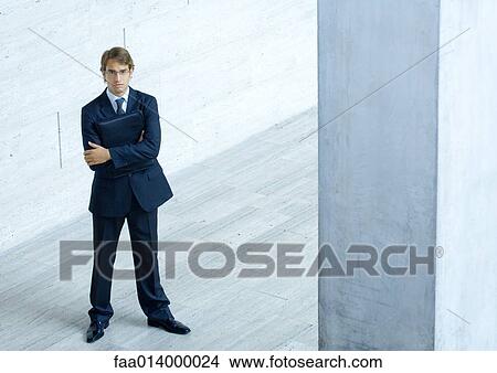 Businessman, full length portrait, high angle view View Large Photo Image Picture - Businessman, full length portrait, high angle view. Fotosearch