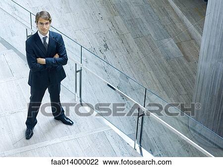 Businessman, full length portrait, high angle view View Large Photo Image Stock Image - Businessman, full length portrait, high angle view. Fotosearch