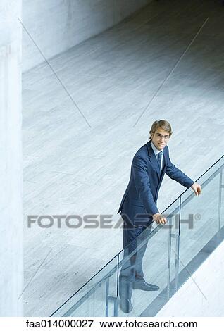 Stock Photo - Businessman, full length portrait, high angle view. Fotosearch