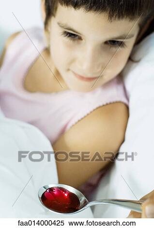 Child being fed spoonful of medicine View Large Photo Image Stock Photography - Child being fed spoonful of medicine. Fotosearch