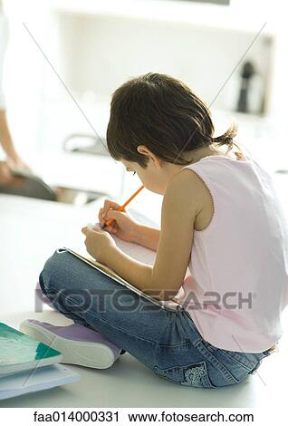 Child sitting, doing homework View Large Photo Image Stock Image - Child sitting, doing homework. Fotosearch