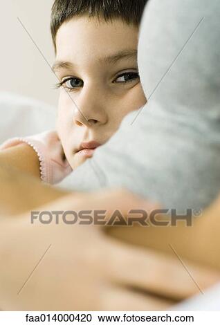 Child with arm around mother View Large Photo Image Stock Image - Child with arm around mother. Fotosearch