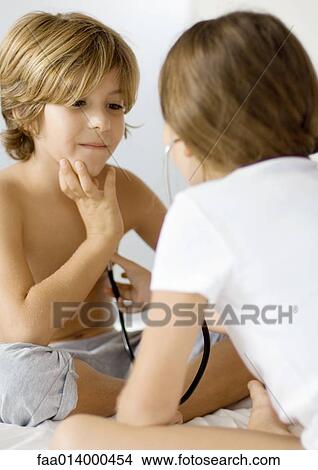 Children playing doctor with stethoscope View Large Photo Image Picture - Children playing doctor with stethoscope. Fotosearch