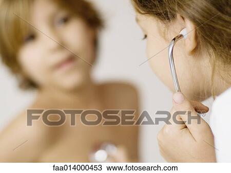 Children playing doctor with stethoscope View Large Photo Image Stock Image - Children playing doctor with stethoscope. Fotosearch