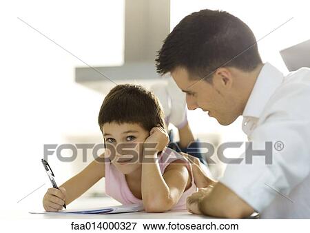 Father helping child with homework View Large Photo Image Stock Photo - Father helping child with homework. Fotosearch