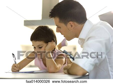 Father helping child with homework View Large Photo Image Stock Photograph - Father helping child with homework. Fotosearch