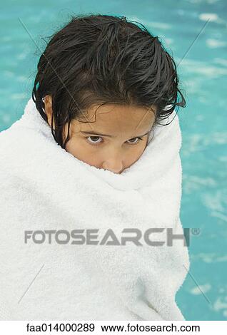 Girl wrapped in towel, pool in background View Large Photo Image Stock Photo - Girl wrapped in towel, pool in background. Fotosearch