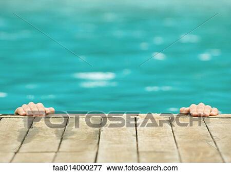 Hands on edge of pool View Large Photo Image Stock Photo - Hands on edge of pool. Fotosearch