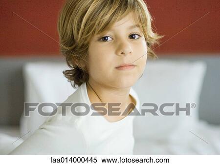 Little boy, bed in background View Large Photo Image Stock Photography - Little boy, bed in background. Fotosearch