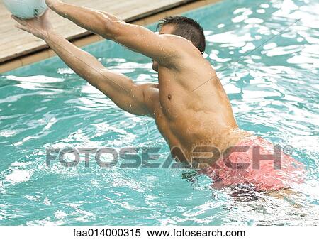 Man jumping for volleyball in water View Large Photo Image Stock Photography - Man jumping for volleyball in water. Fotosearch