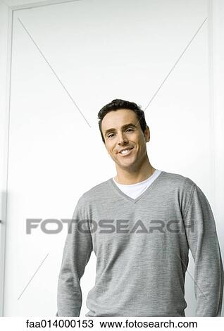 Man smiling, waist up, portrait View Large Photo Image Stock Image - Man smiling, waist up, portrait. Fotosearch