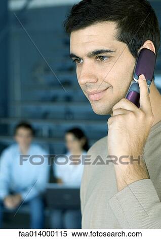 Man using cell phone, smiling View Large Photo Image Stock Photography - Man using cell phone, smiling. Fotosearch