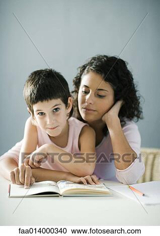 Mother helping child with homework View Large Photo Image Stock Image - Mother helping child with homework. Fotosearch