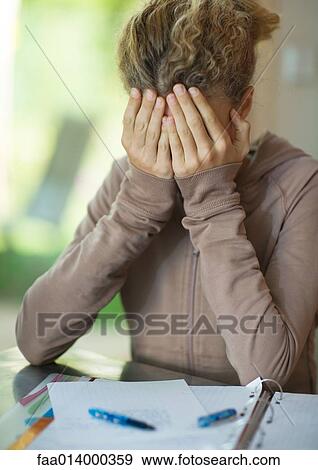 Preteen girl doing homework, covering face View Large Photo Image Stock Photo - Preteen girl doing homework, covering face. Fotosearch