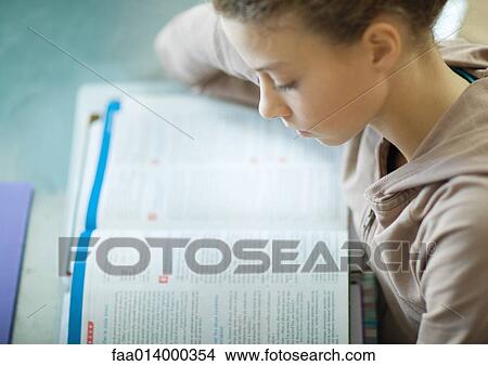 Preteen girl doing homework View Large Photo Image Picture - Preteen girl doing homework. Fotosearch