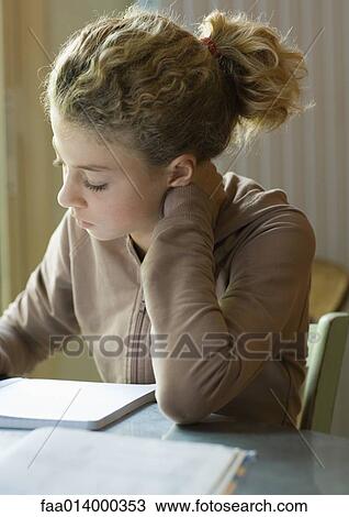 Preteen girl doing homework View Large Photo Image Stock Image - Preteen girl doing homework. Fotosearch