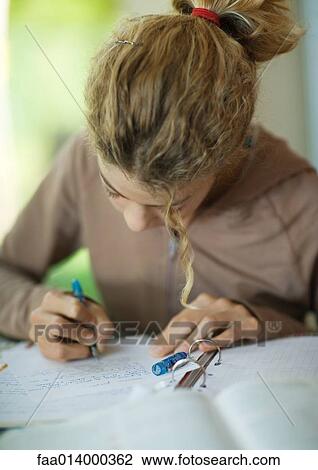 Preteen girl doing homework View Large Photo Image Stock Image - Preteen girl doing homework. Fotosearch