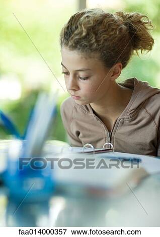 Preteen girl doing homework View Large Photo Image Stock Photo - Preteen girl doing homework. Fotosearch