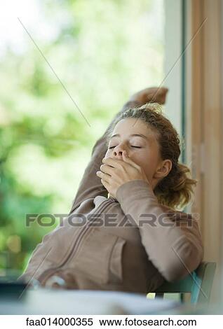 Preteen girl yawning and stretching View Large Photo Image Stock Photography - Preteen girl yawning and stretching. Fotosearch