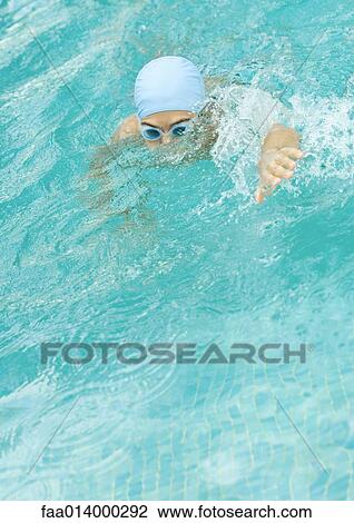Swimmer wearing bathing cap and goggles View Large Photo Image Stock Image - Swimmer wearing bathing cap and goggles. Fotosearch