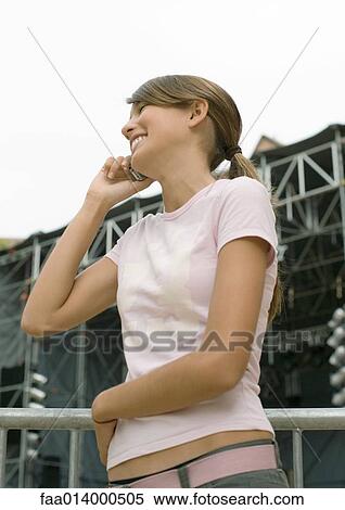 Teenage girl using cell phone, waist up View Large Photo Image Stock Photography - Teenage girl using cell phone, waist up. Fotosearch