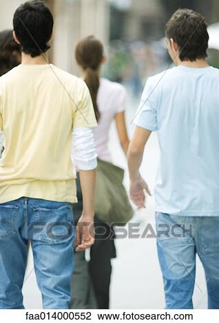 Teenagers walking, rear view View Large Photo Image Stock Image - Teenagers walking, rear view. Fotosearch