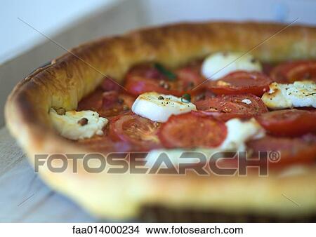 Tomato, goat cheese and ham tart, baked View Large Photo Image Picture - Tomato, goat cheese and ham tart, baked. Fotosearch