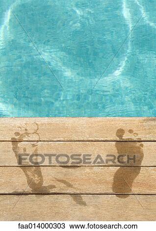 Wet footprints by edge of swimming pool View Large Photo Image Stock Image - Wet footprints by edge of swimming pool. Fotosearch