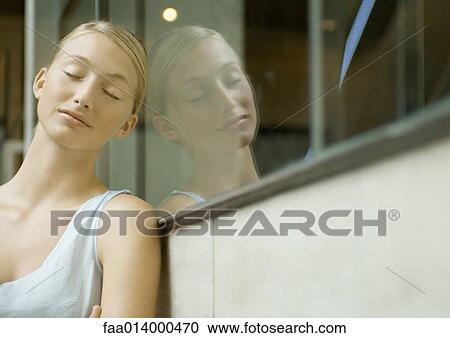 Woman resting head aganst window pane, eyes closed View Large Photo Image Stock Image - Woman resting head aganst window pane, eyes closed. Fotosearch