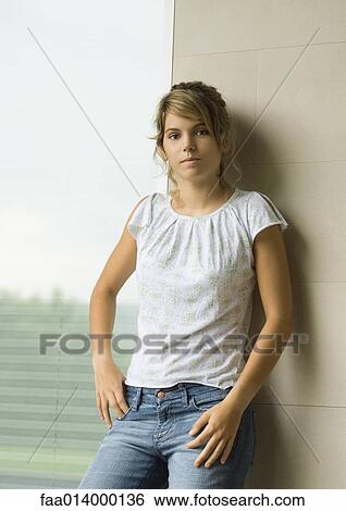 Stock Photograph - Young woman, portrait, three quarter length. Fotosearch