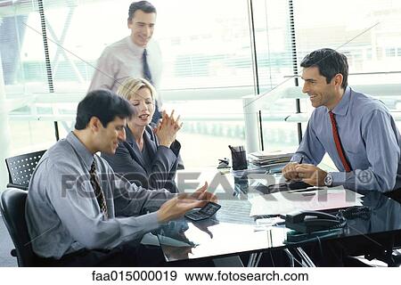 Business colleagues having casual meeting View Large Photo Image Stock Photo - Business colleagues having casual meeting. Fotosearch