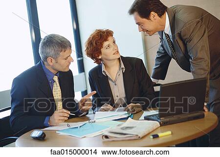 Business colleagues working at table View Large Photo Image Picture - Business colleagues working at table. Fotosearch