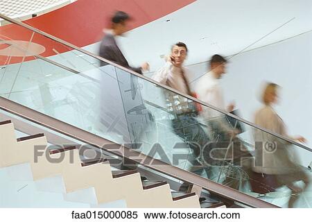 Business executives going down staircase View Large Photo Image Stock Photography - Business executives going down staircase. Fotosearch