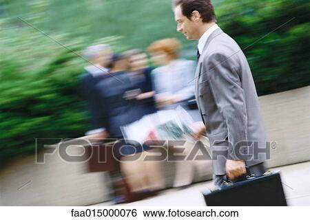 Businessman carrying bouquet of flowers and briefcase View Large Photo Image Stock Photograph - Businessman carrying bouquet of flowers and briefcase. Fotosearch