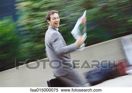 Businessman carrying bouquet of flowers View Large Photo Image Stock Photography - Businessman carrying bouquet of flowers. Fotosearch