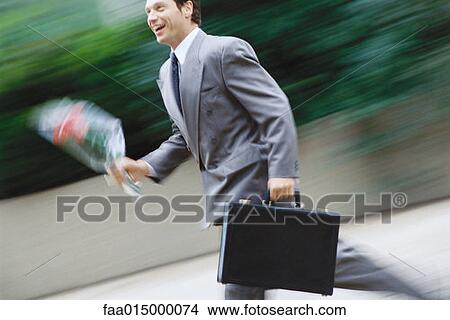 Businessman running with bouquet of flowers View Large Photo Image Picture - Businessman running with bouquet of flowers. Fotosearch