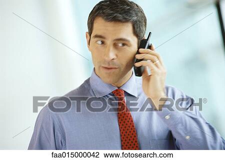 Businessman using phone View Large Photo Image Stock Image - Businessman using phone. Fotosearch