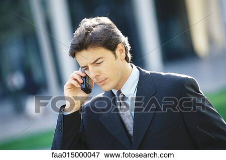 Businessman using phone View Large Photo Image Stock Photo - Businessman using phone. Fotosearch