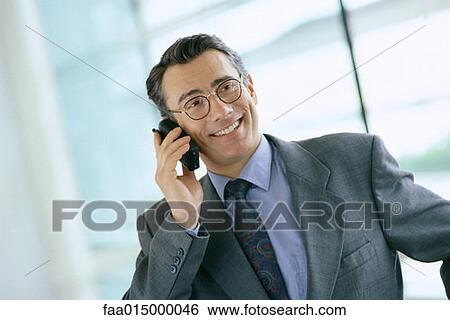 Businessman using phone View Large Photo Image Stock Photograph - Businessman using phone. Fotosearch