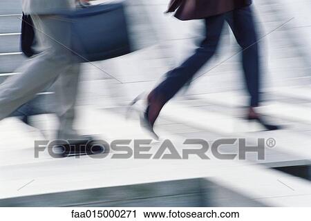 Businesspeople crossing street, low section View Large Photo Image Stock Image - Businesspeople crossing street, low section. Fotosearch