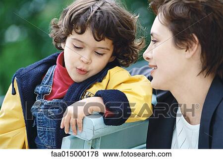 Stock Photo - Businesswoman and little boy. Fotosearch