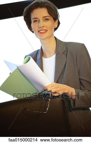Businesswoman holding document View Large Photo Image Picture - Businesswoman holding document. Fotosearch