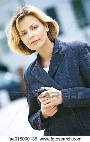 Businesswoman holding phone View Large Photo Image Stock Photography - Businesswoman holding phone. Fotosearch
