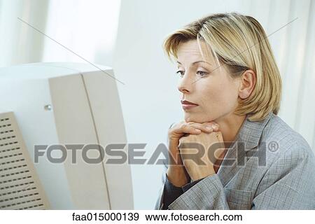 Businesswoman using desktop computer View Large Photo Image Stock Photo - Businesswoman using desktop computer. Fotosearch