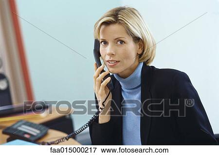 Businesswoman using phone View Large Photo Image Stock Photo - Businesswoman using phone. Fotosearch
