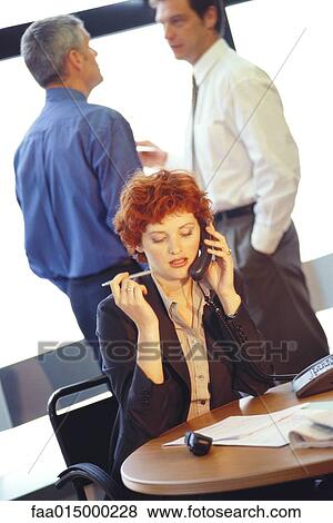 Businesswoman using phone View Large Photo Image Stock Photo - Businesswoman using phone. Fotosearch