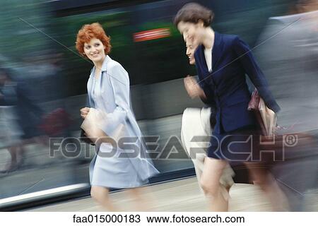 Businesswomen hurrying, blurred motion View Large Photo Image Stock Image - Businesswomen hurrying, blurred motion. Fotosearch
