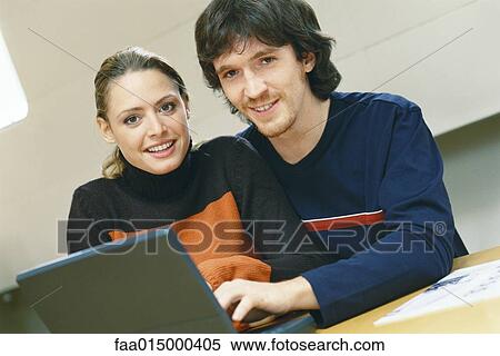 Couple using laptop View Large Photo Image Stock Photography - Couple using laptop. Fotosearch