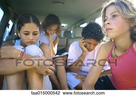 Four children sitting in back of car View Large Photo Image Stock Image - Four children sitting in back of car. Fotosearch