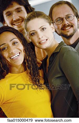 Stock Photo - Four young adults, casually dressed, portrait. Fotosearch